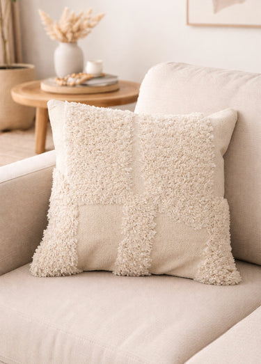Coussin carré tufté motif abstrait Beige