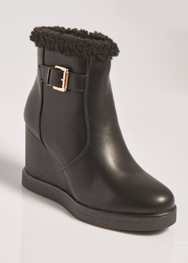 Boots fourrées à talon compensé Noir