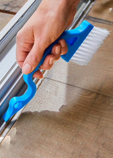 Brosse ergonomique nettoie rainures Bleu