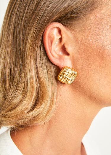 Boucles d'oreilles torsadées carré Dore