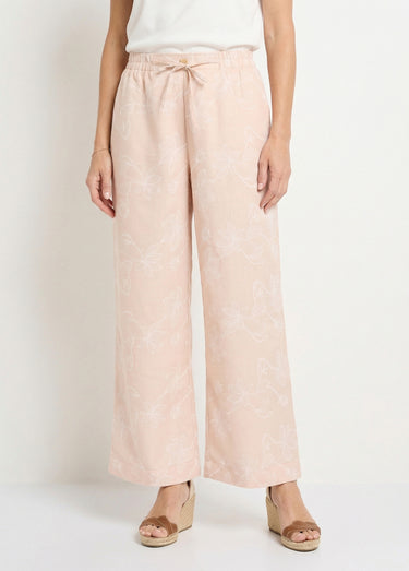 Pantalon large avec sérigraphies fleurs Beige