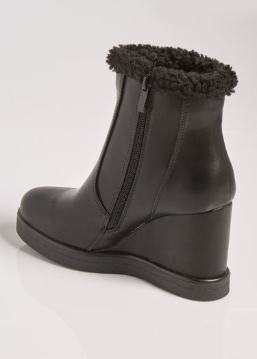 Boots fourrées à talon compensé Noir