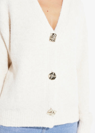 Gilet chaud avec boutons bijou en métal Ecru