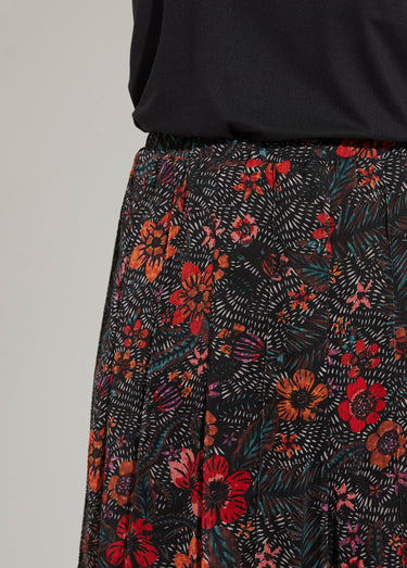 Jupe longue évasée en voile fleuri Noir/Rouge
