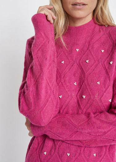 Pull doux ajouré perlé col montant Rose