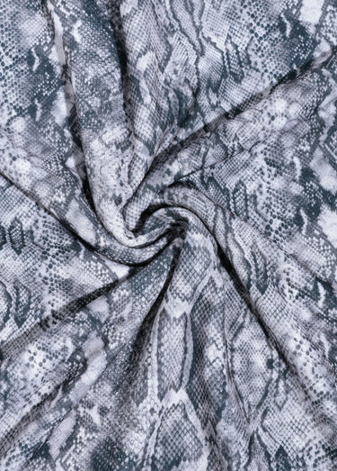 Coupon tissu habillement, motif reptile Imprime Gris