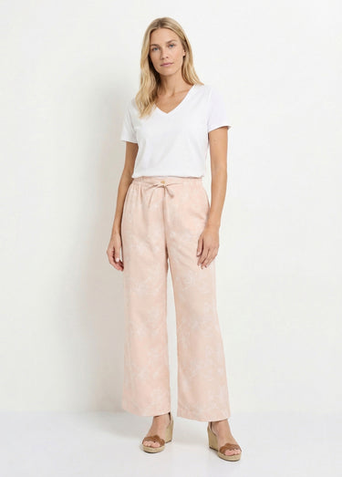 Pantalon large avec sérigraphies fleurs Beige