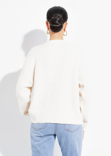 Gilet chaud avec boutons bijou en métal Ecru