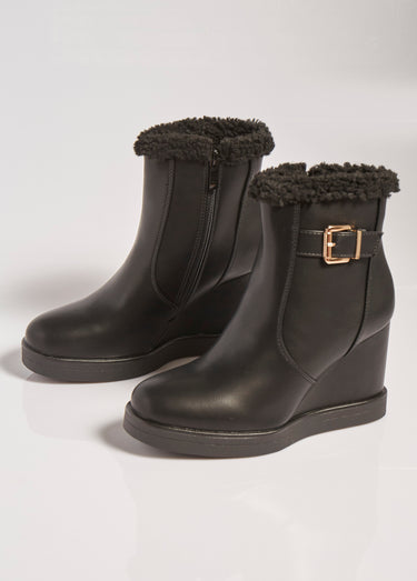 Boots fourrées à talon compensé Noir