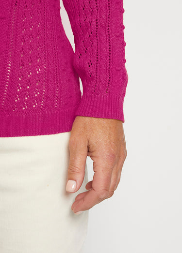 Pull col rond maille ajourée et boules Fuchsia