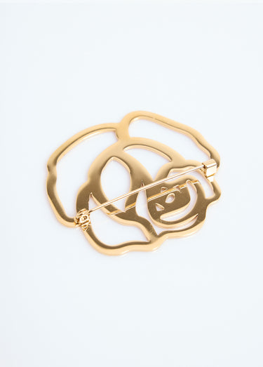 Broche métallisée en forme de fleur Dore