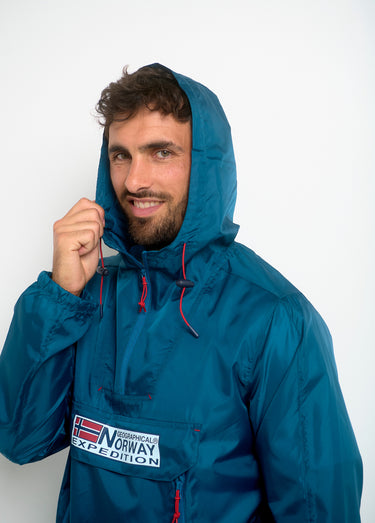 Coupe vent homme demi zip à capuche Petrole