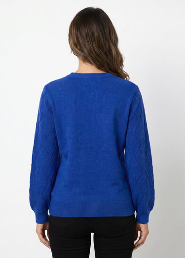 Pull doux ajouré perlé col montant Bleu