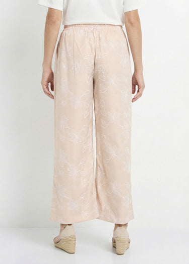 Pantalon large avec sérigraphies fleurs Beige